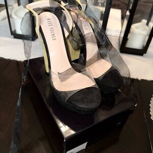 Elegant Black and Cream Slingback Heels with Adjustable Strap